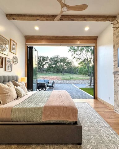 Modern glass retreat interior with Hill Country views and cowhide rug